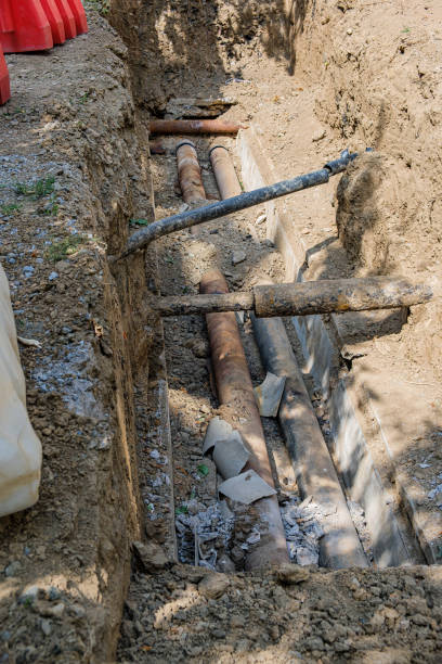 istock Old leaky pipes in the pit. Preparation for pipe replacement 1424052525