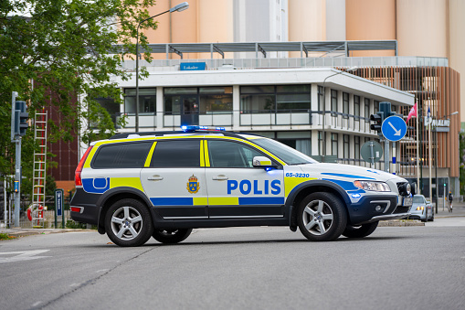 Malmö, Sweden - July 09 2022: Swedish Volvo police car blocking a road to give way for a demonstration.