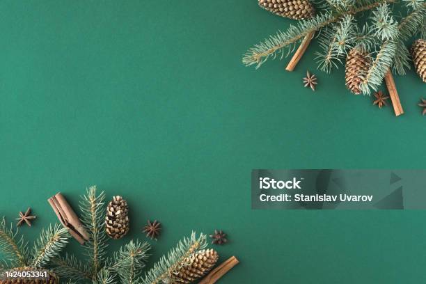 Creative Layout Made Of Christmas Tree Branches On Green Paper Background Flat Lay Top View Nature New Year Concept Stock Photo - Download Image Now