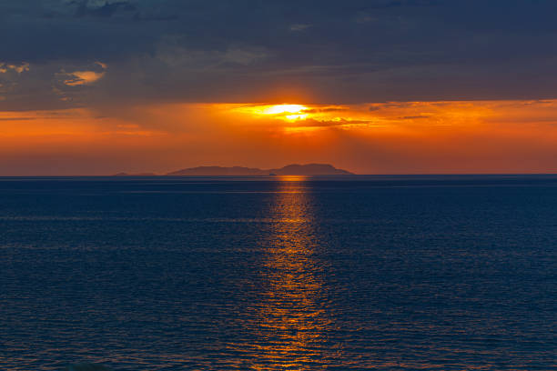 Sunset from the beach in Acharavi, Corfu island, Greece