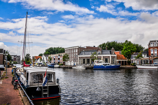 Yachts Moored On Sneek De Geau River Canal, The Netherlands