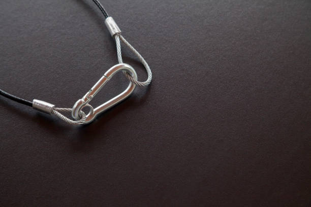 istock Steel cable on top of a black table with space for text 1424058747