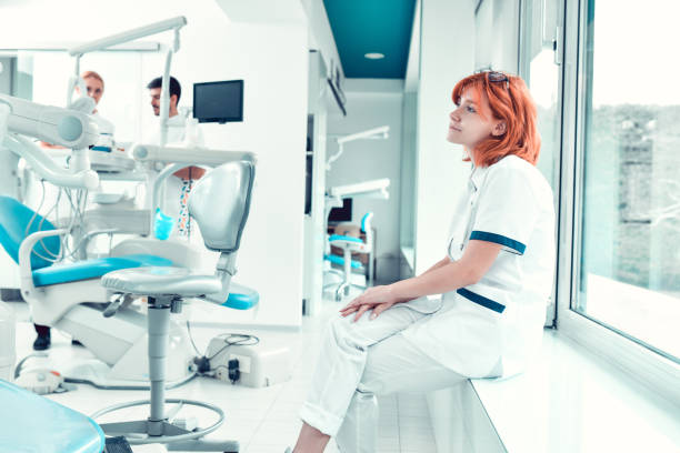 Female Dentist And Her Team Waiting For Patients