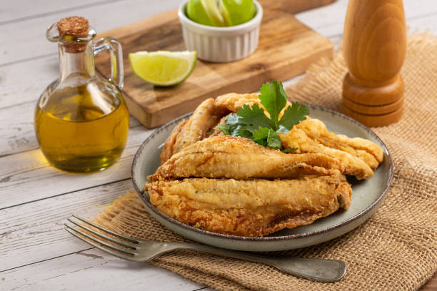 istock Fried sardines in the plate on the table. 1424064671