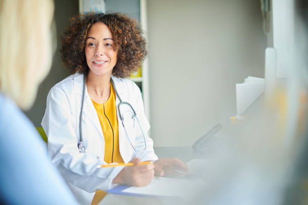 istock female gp chatting to patient 1424066916