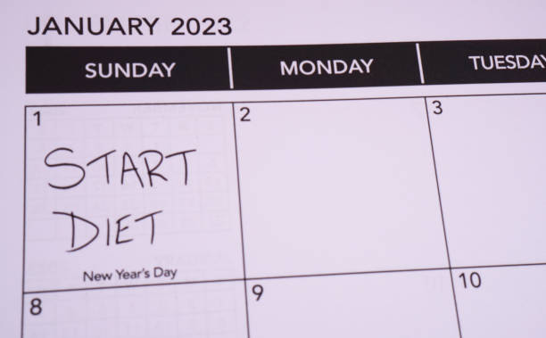 risoluzione di capodanno per iniziare la dieta - dieting planning calendar event foto e immagini stock