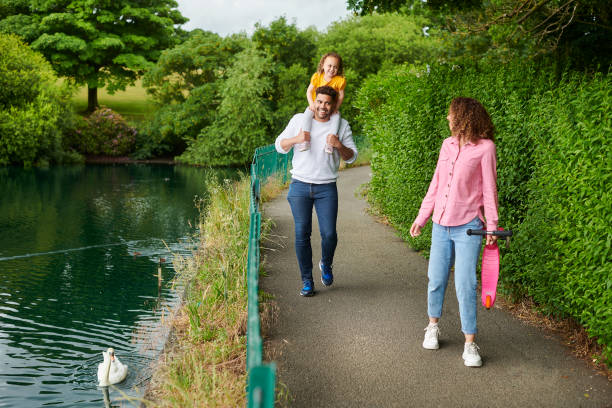 istock young family in the park 1424080935