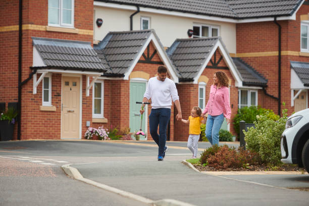 istock family walking through the housing development 1424081499