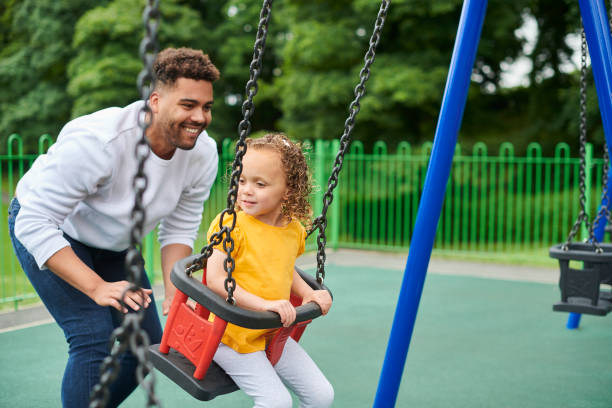 istock father and daughter in the park 1424081595