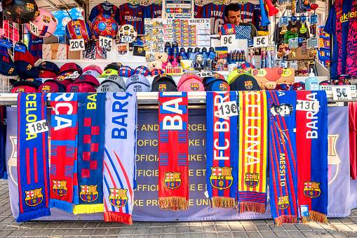 Barcelona, Spain - August 29, 2022: Close-up shot of a store stocked with FC Barcelona merchandise and souvenirs. There are no people on the scene.