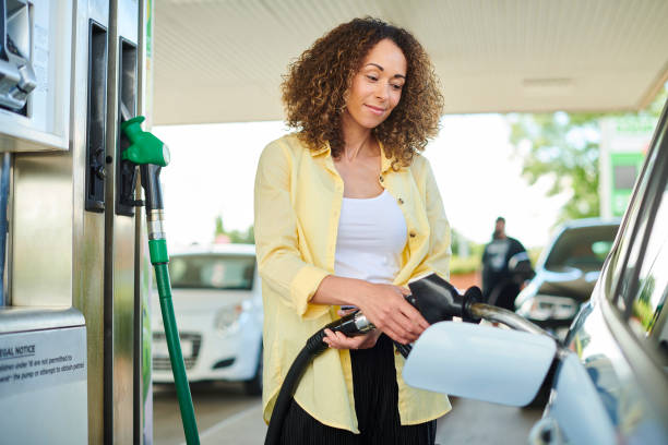 istock petrol pump woman 1424087689