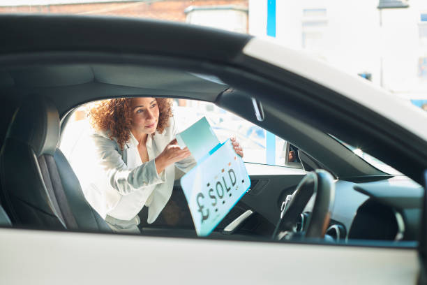 istock car sales person portrait 1424088370