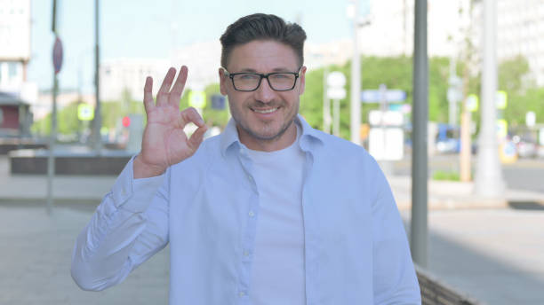 istock Man showing Ok Sign with Finger Outdoor 1424092364
