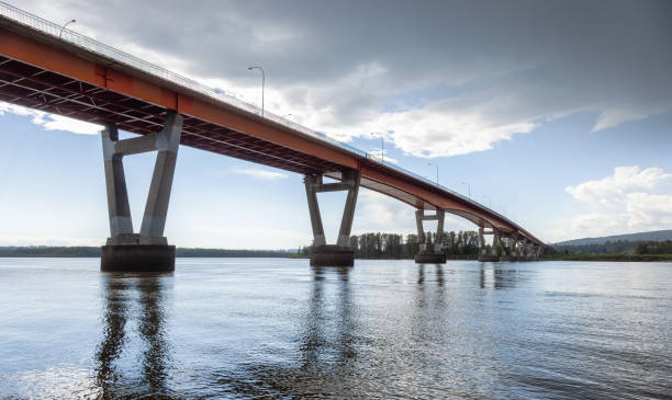 istock Mission Bridge over Fraser River during Sunny and Cloudy Spring Season Day. 1424096126