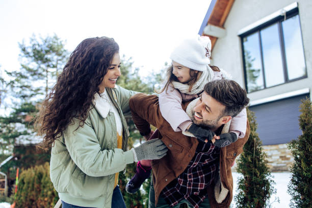 istock Girl having fun with mom and dad on the mountain 1424097287