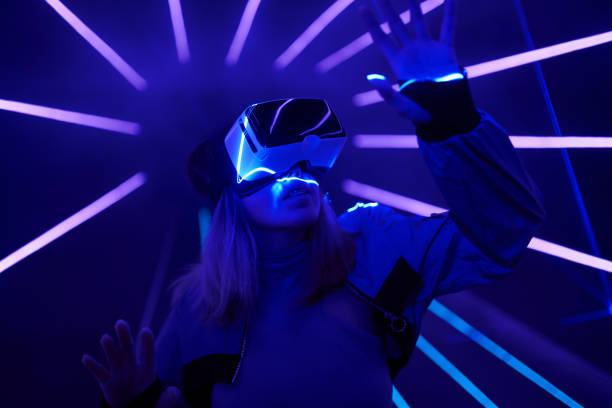 istock Woman is using virtual reality headset to access in metaverse. 1424097373