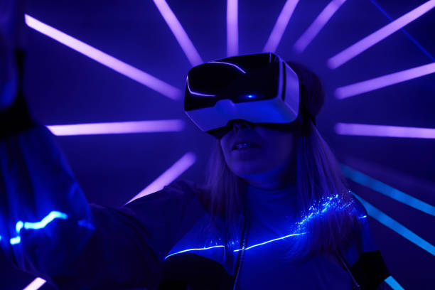 istock Woman is using virtual reality headset to access in metaverse. 1424097414