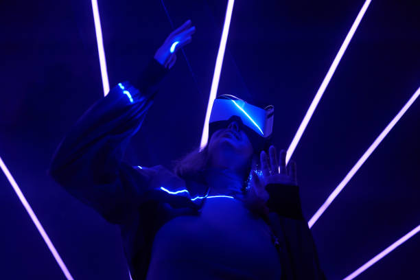 istock Woman is using virtual reality headset to access in metaverse. 1424097444