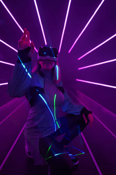 istock Woman is using virtual reality headset to access in metaverse. 1424097510
