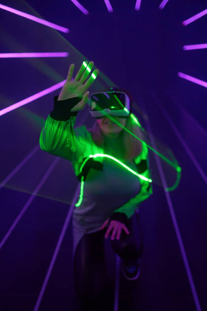 istock Woman is using virtual reality headset to access in metaverse. 1424097609