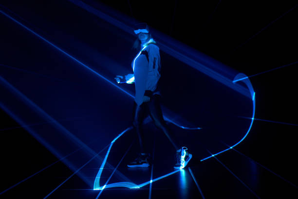 istock Woman is using virtual reality headset to access in metaverse. 1424097692