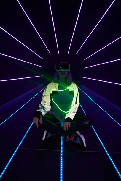 istock Woman is using virtual reality headset to access in metaverse. 1424097761