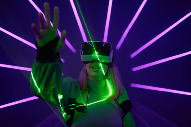 istock Woman is using virtual reality headset to access in metaverse. 1424097817