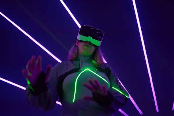 istock Woman is using virtual reality headset to access in metaverse. 1424097886