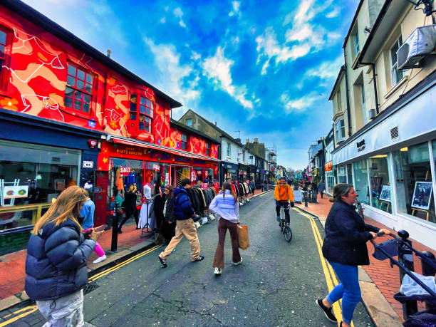 Brighton, United Kingdom - March 04 2022: a clothing store in vibrant painted colors with people walking on the street