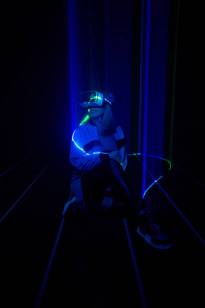 istock Woman is using virtual reality headset to access in metaverse. 1424098031