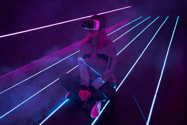 istock Woman is using virtual reality headset to access in metaverse. 1424098112