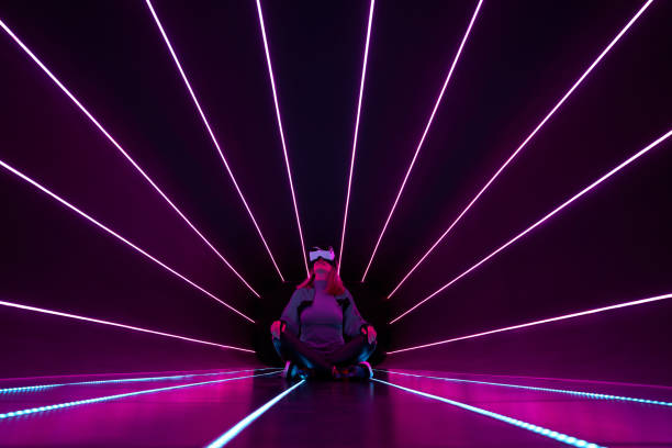 istock Woman is using virtual reality headset to access in metaverse. 1424098145