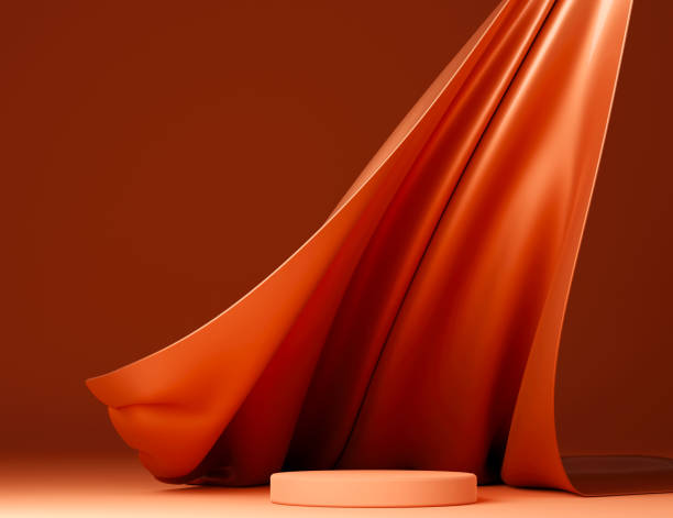 istock Dark orange podium with pink flying fabric, cloth background 1424098325
