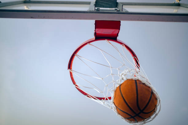 istock Good shot! Basketball in the net 1424099497