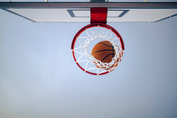 istock Basketball goes through the net 1424099501
