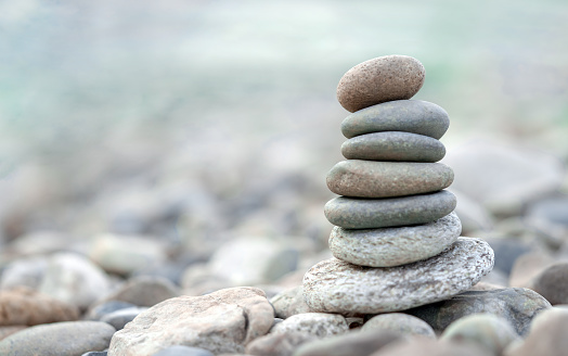 Pyramid of sea pebbles. Zen stones. Life balance, meditation, spa, calmness, harmony concept