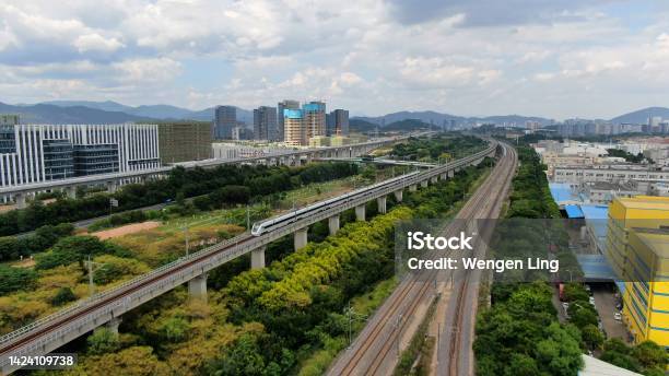 Highspeed Train Passes Through Town Stock Photo - Download Image Now - Shinkansen, Aerial View, Railroad Track