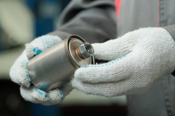 istock The fuel filter is new for the car engine. Close-up. 1424115662