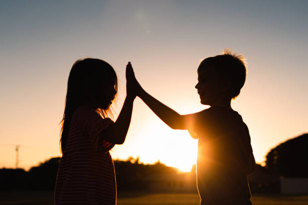 istock Boy giving girl high five. Success. Achievement. 1424123713