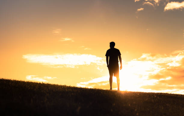 istock Men enjoying beautiful sunset. 1424123934