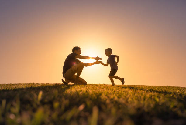 istock Father and son playing with a toy airplane. 1424124178
