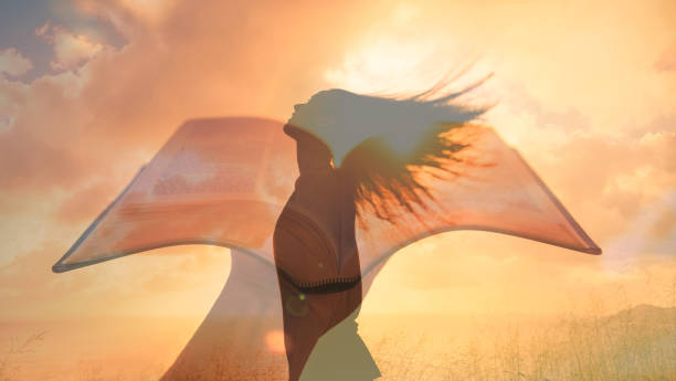 istock Woman praying, feeling free. Religious, freedom concept. 1424124319
