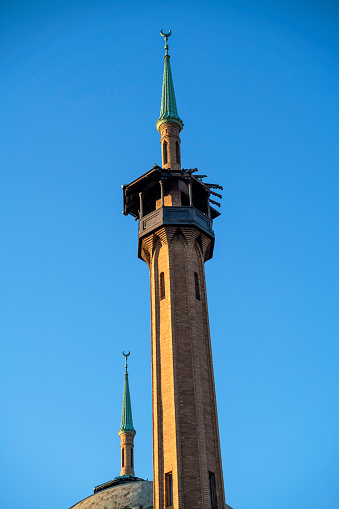 Top towers of Irem Temple building in downtown Wilkes-Barre against the blue sky in spring.