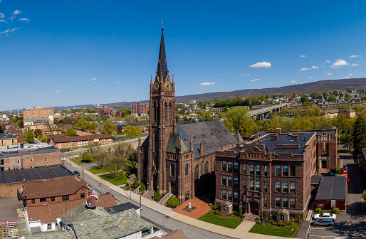 istock St. Nicholas R. C. Church in Wilkes-Barre, Pennsylvania, panoramic view in spring. 1424125882