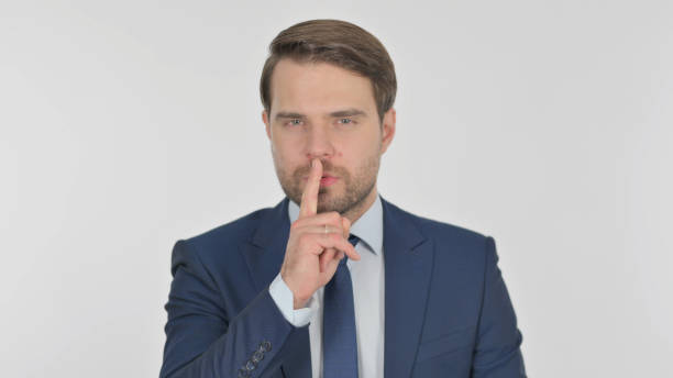 istock Young Man with Finger on Lips, Silence Yellow Screen 1424131598