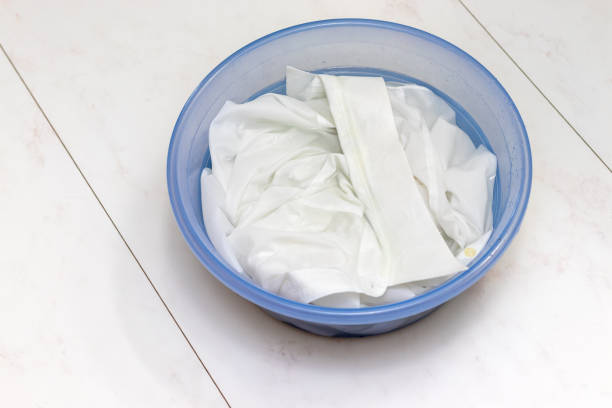 istock White shirt soaked in water in a basin 1424132185