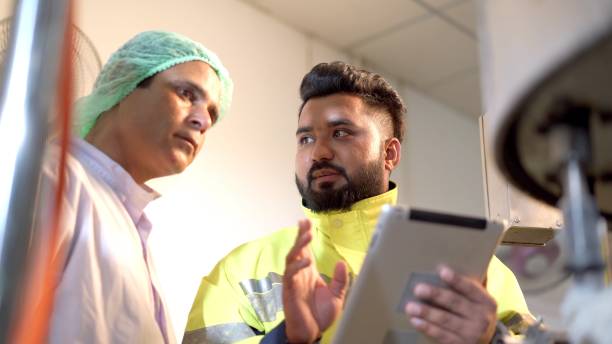 istock Quality control staff working in the factory. 1424136433
