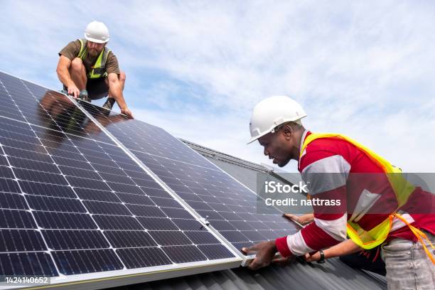 Installing A Residential Solar System Stock Photo - Download Image Now - Renewable Energy, Installing, Occupation
