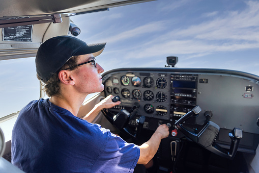 High quality stock photos of a young certified pilot performing safety checks and inspections on a small engine airplane in Calfornia.