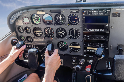 High quality stock photos of a young certified pilot performing safety checks and inspections on a small engine airplane in Calfornia.